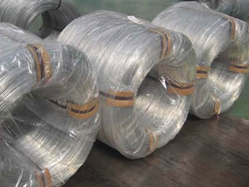 Four large coils of PC strand: inside tied up by baling strip, outside wrapped with plastic film.