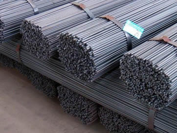 Lots of steel bar in bundles tied up with steel strip.